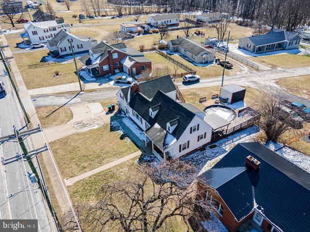 birds eye view of property with a residential view