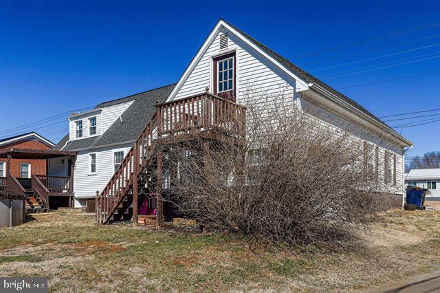 view of side of home with stairs