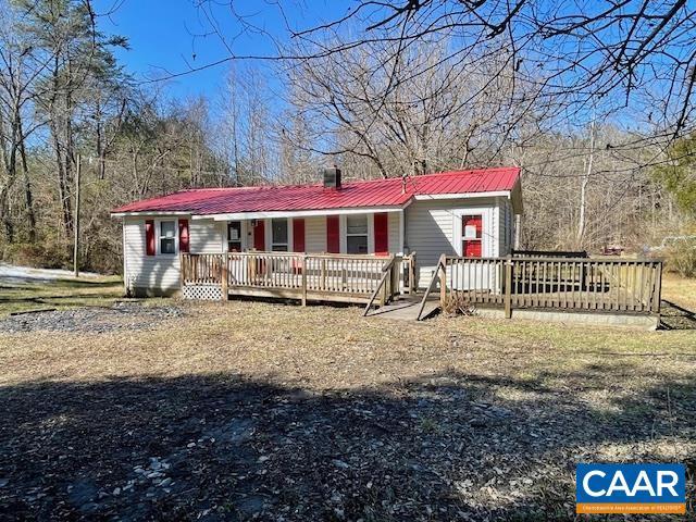 ranch-style home with a wooden deck