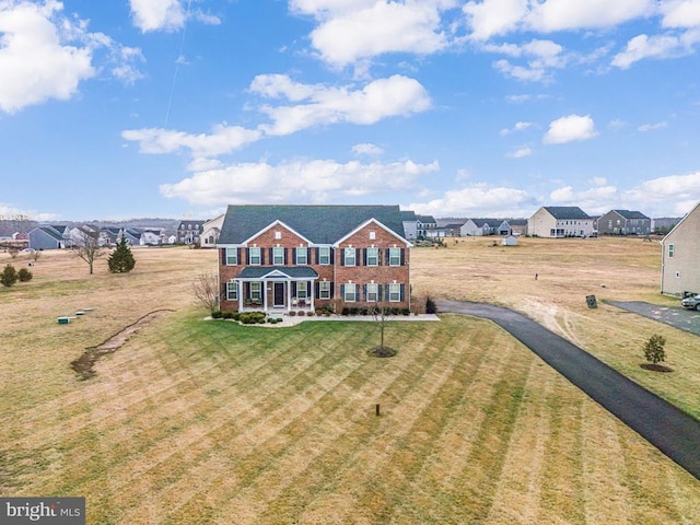 view of front of property featuring a front lawn and covered porch