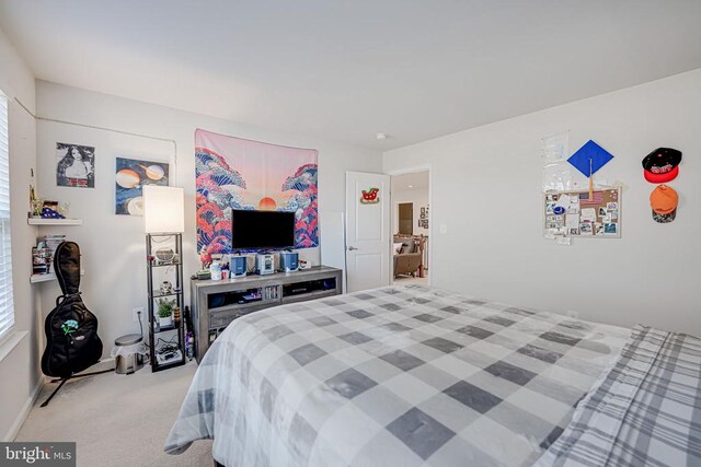 bedroom featuring light colored carpet