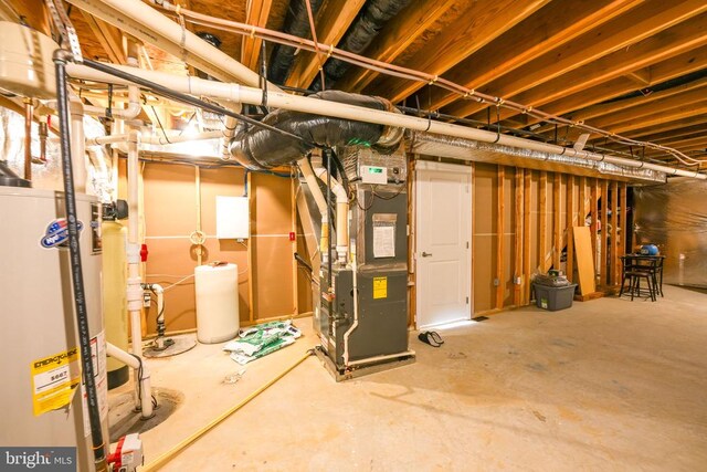 basement with heating unit and water heater