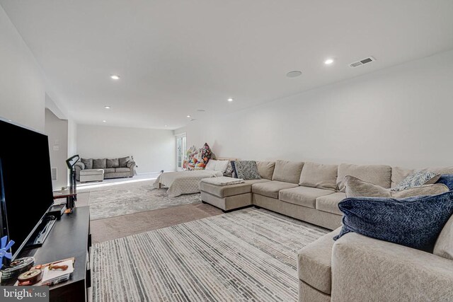 living room featuring light carpet