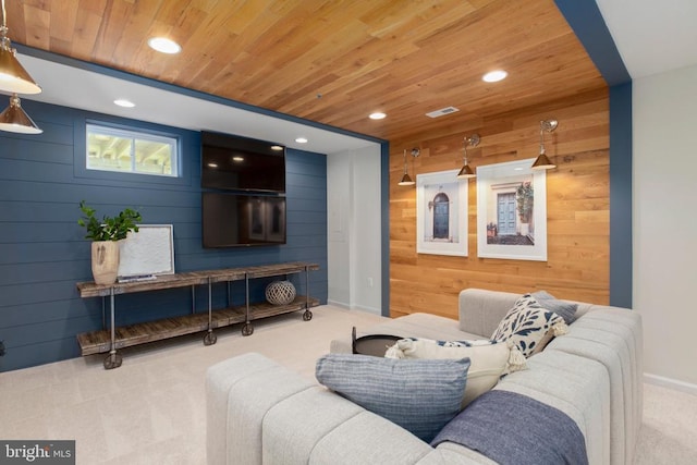 living room featuring wood ceiling, light colored carpet, and wood walls