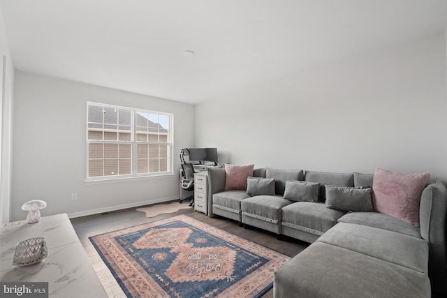 living area featuring wood finished floors and baseboards