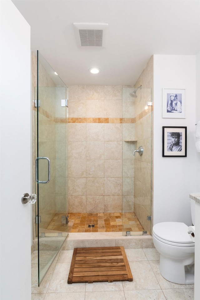 bathroom with tile patterned floors, toilet, visible vents, recessed lighting, and a shower stall