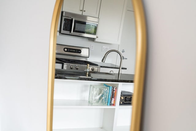kitchen featuring appliances with stainless steel finishes and gray cabinets