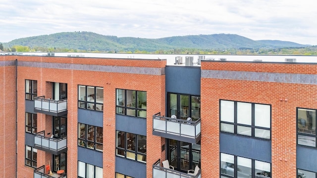 view of building exterior featuring a mountain view