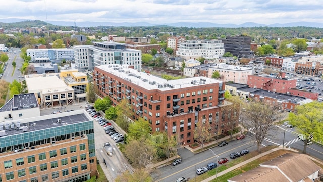 birds eye view of property with a city view and a mountain view