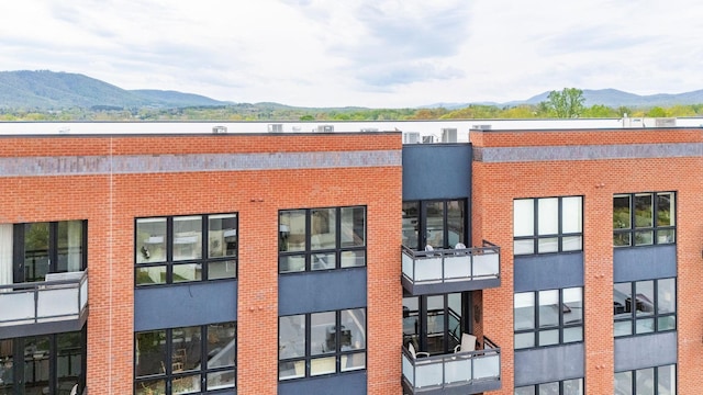 view of building exterior with a mountain view