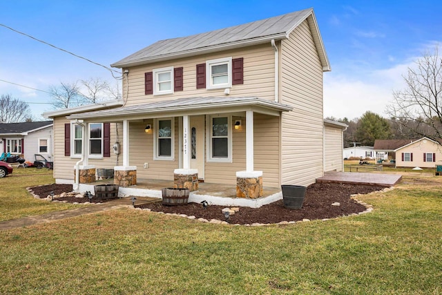 view of front of house with covered porch and a front lawn