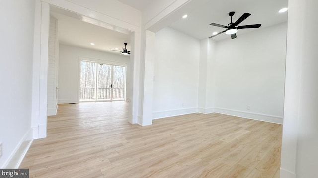 empty room featuring light hardwood / wood-style floors and ceiling fan