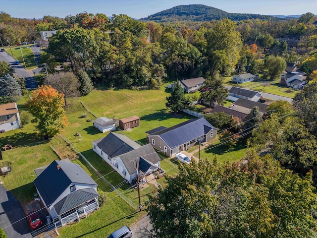 aerial view featuring a residential view and a wooded view