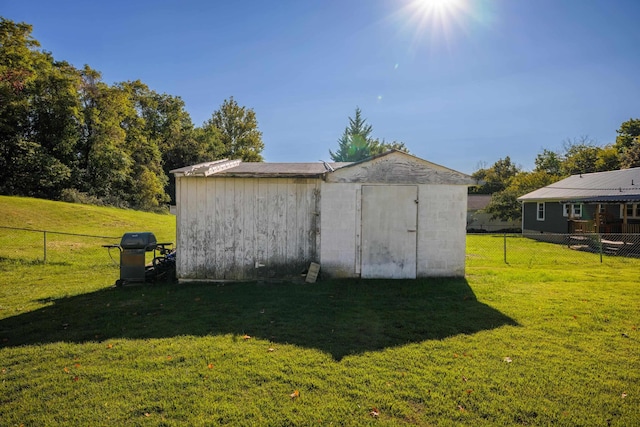 view of shed with fence