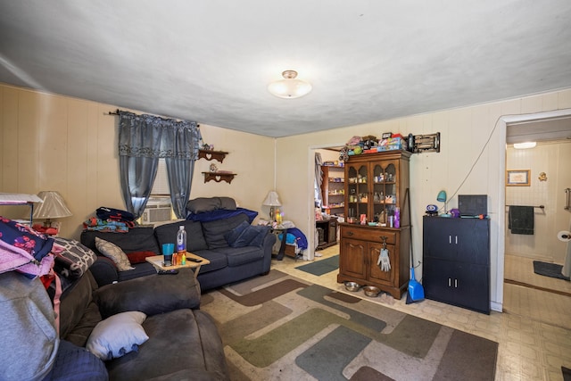 living room featuring tile patterned floors and cooling unit