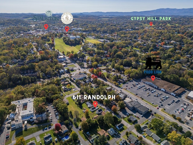 birds eye view of property with a mountain view