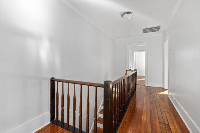 hallway featuring crown molding and wood-type flooring