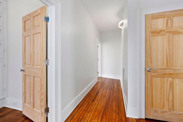 corridor featuring hardwood / wood-style floors