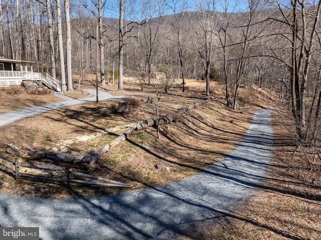 exterior space featuring a forest view