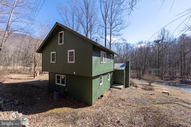 view of property exterior with central AC