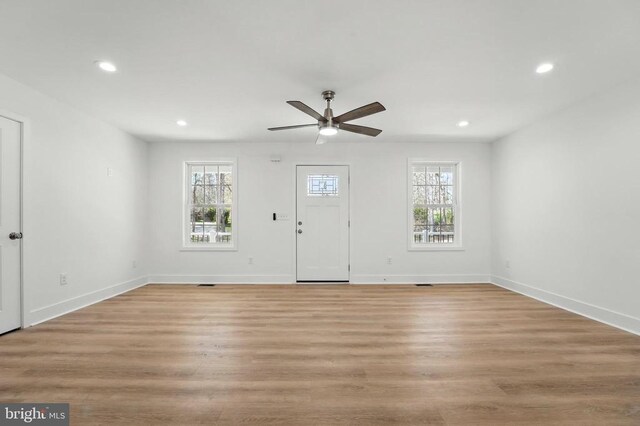 view of property exterior featuring covered porch, aphalt driveway, and a garage