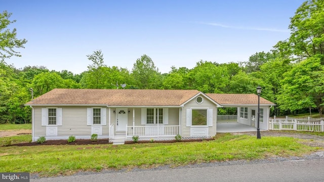 single story home featuring a front yard and a porch