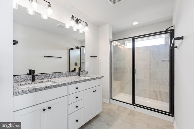 bathroom with vanity and an enclosed shower