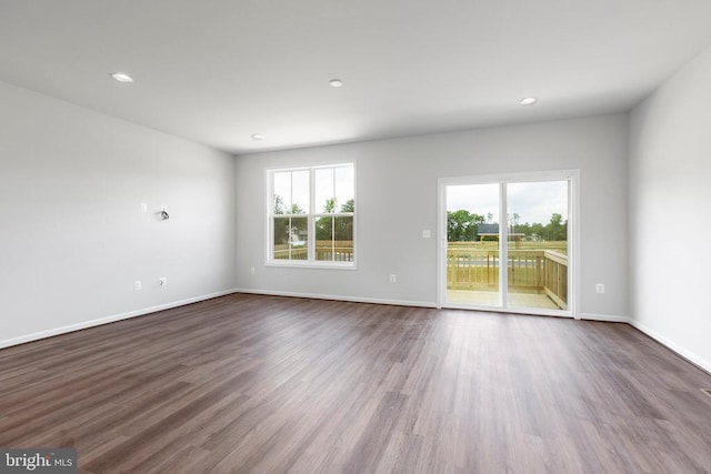 empty room featuring dark hardwood / wood-style floors