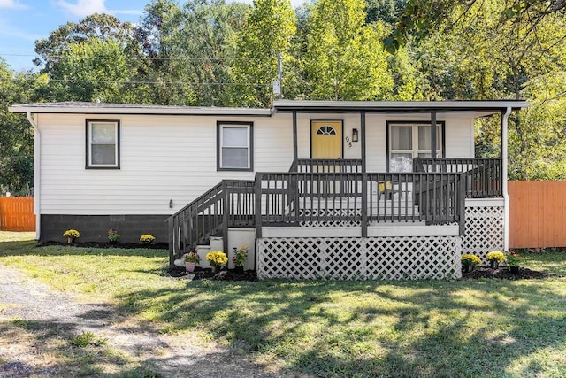 view of front facade with a front yard and a porch