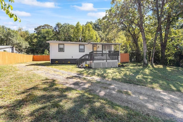 exterior space with a yard and a deck