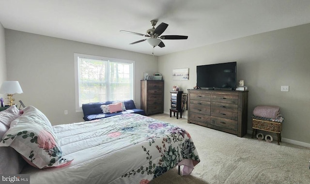 bedroom with carpet flooring, ceiling fan, and baseboards