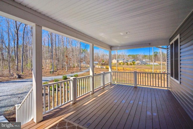 wooden terrace featuring a porch