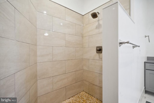 bathroom with a tile shower