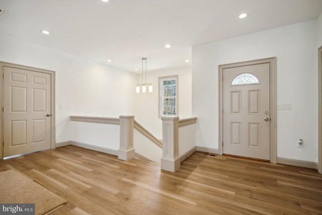 entrance foyer featuring wood-type flooring