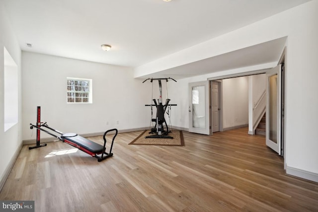 exercise area featuring hardwood / wood-style floors