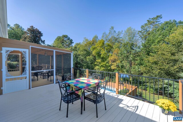 deck with outdoor dining space