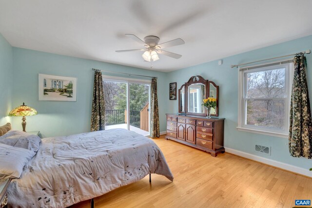 bedroom featuring visible vents, baseboards, light wood-type flooring, a ceiling fan, and access to outside