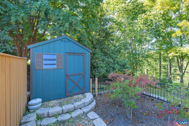 view of shed with fence