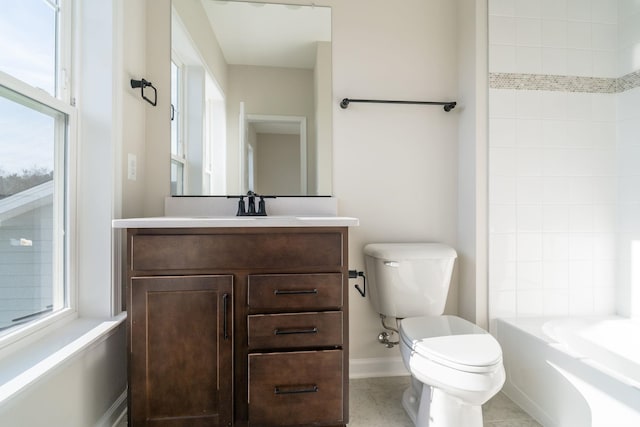 bathroom featuring vanity, tile patterned floors, and toilet