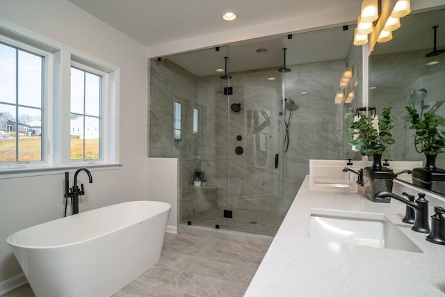 bathroom with vanity and separate shower and tub