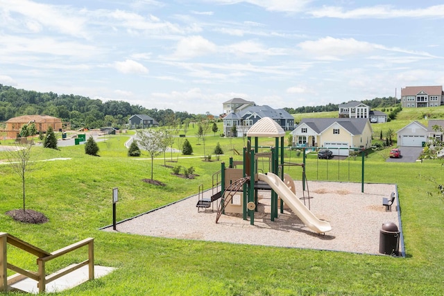 view of jungle gym featuring a lawn