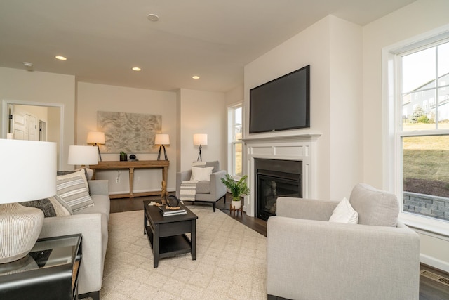 living room with a wealth of natural light and light wood-type flooring