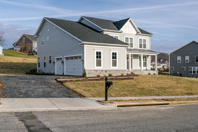 view of front of property featuring a porch, a garage, and a front lawn