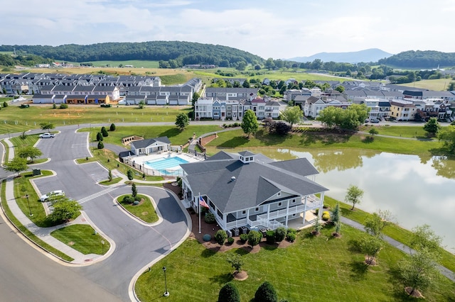 drone / aerial view with a water and mountain view