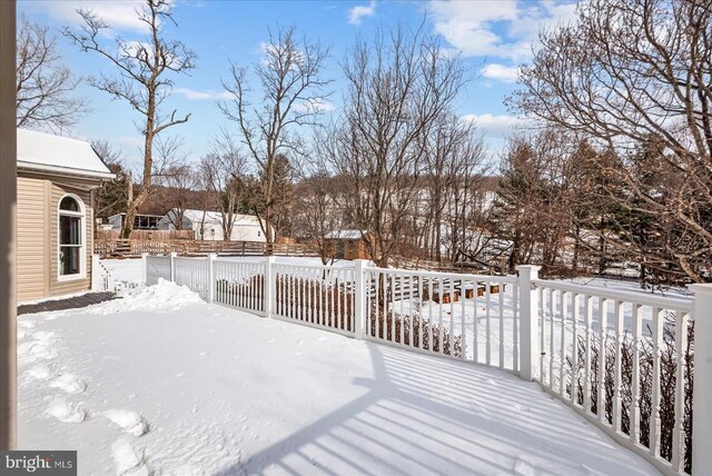 view of snow covered deck