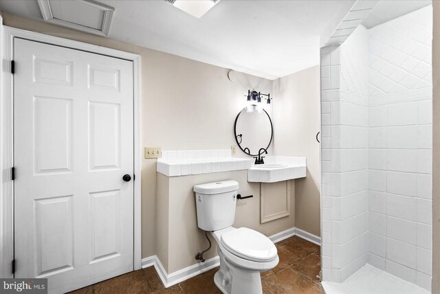 bathroom with tile patterned floors and toilet