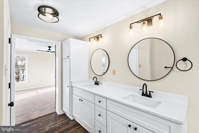 bathroom featuring hardwood / wood-style flooring, vanity, and ceiling fan