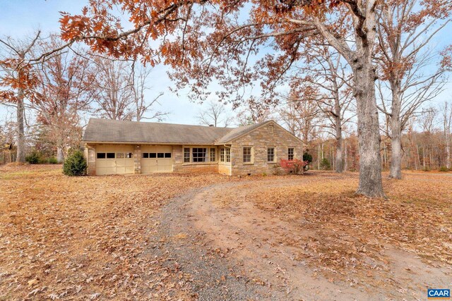 single story home with a garage