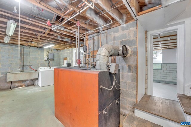 basement with washer / clothes dryer and sink