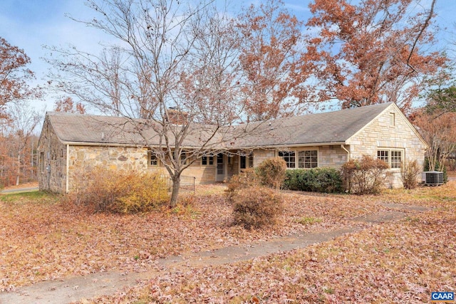 ranch-style home with central air condition unit